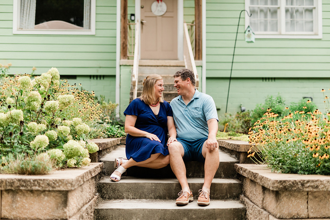 family posing on front porch