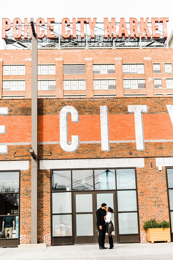 Joyful family moment captured outdoors at Ponce City Market during the holidays.