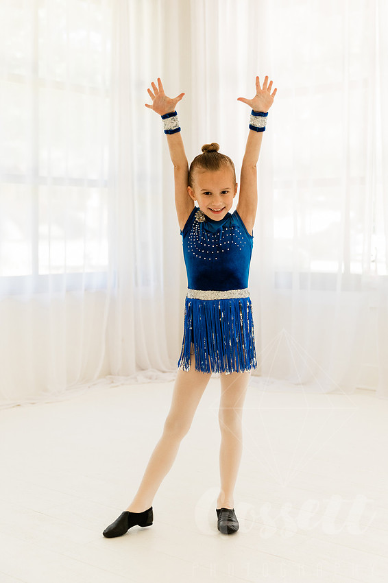 Ballerinas pose in a natural light studio