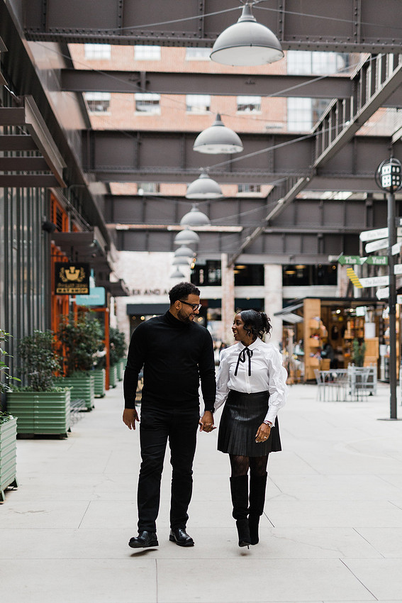 Joyful family moment captured outdoors at Ponce City Market during the holidays.