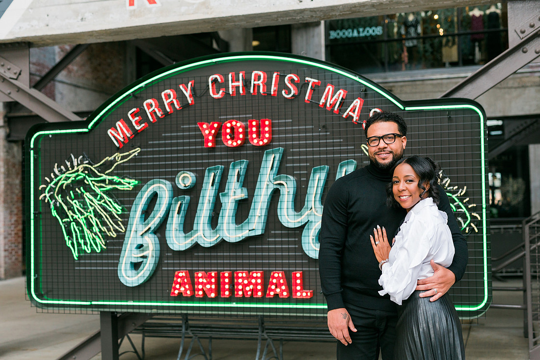 Joyful family moment captured outdoors at Ponce City Market during the holidays.