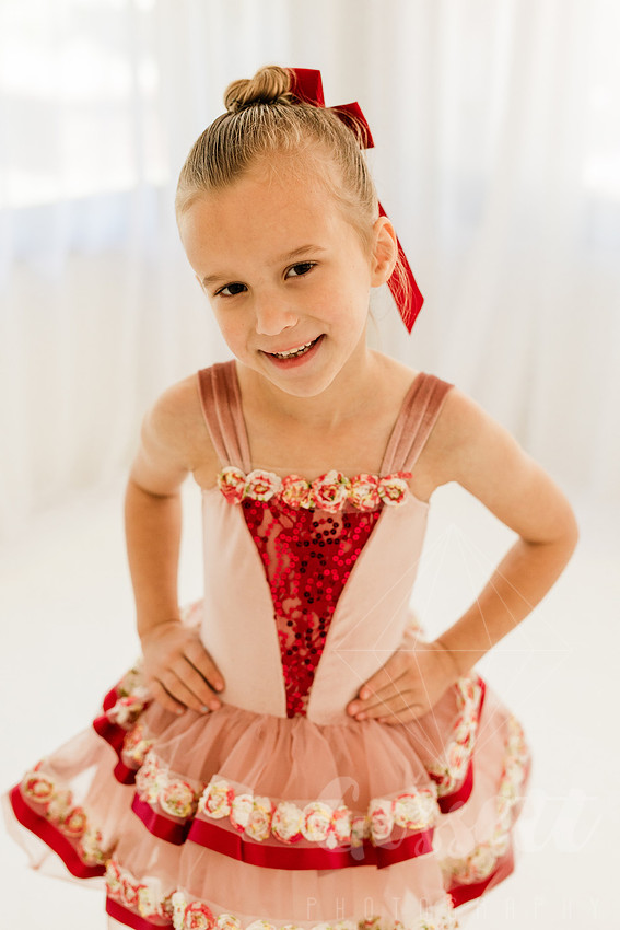 Ballerinas pose in a natural light studio