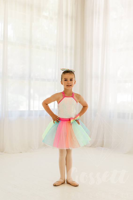 Ballerinas pose in a natural light studio