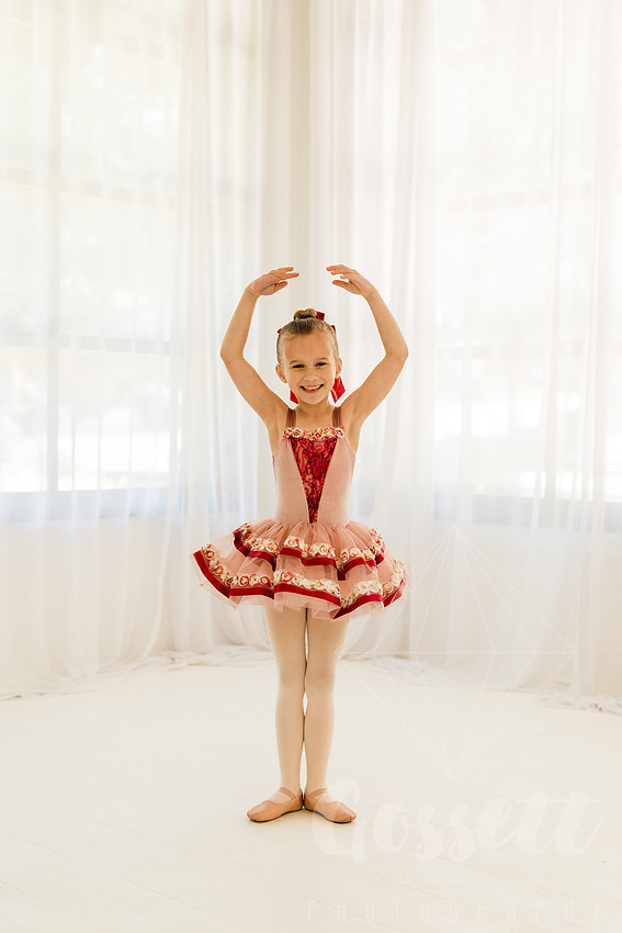 Ballerinas pose in a natural light studio