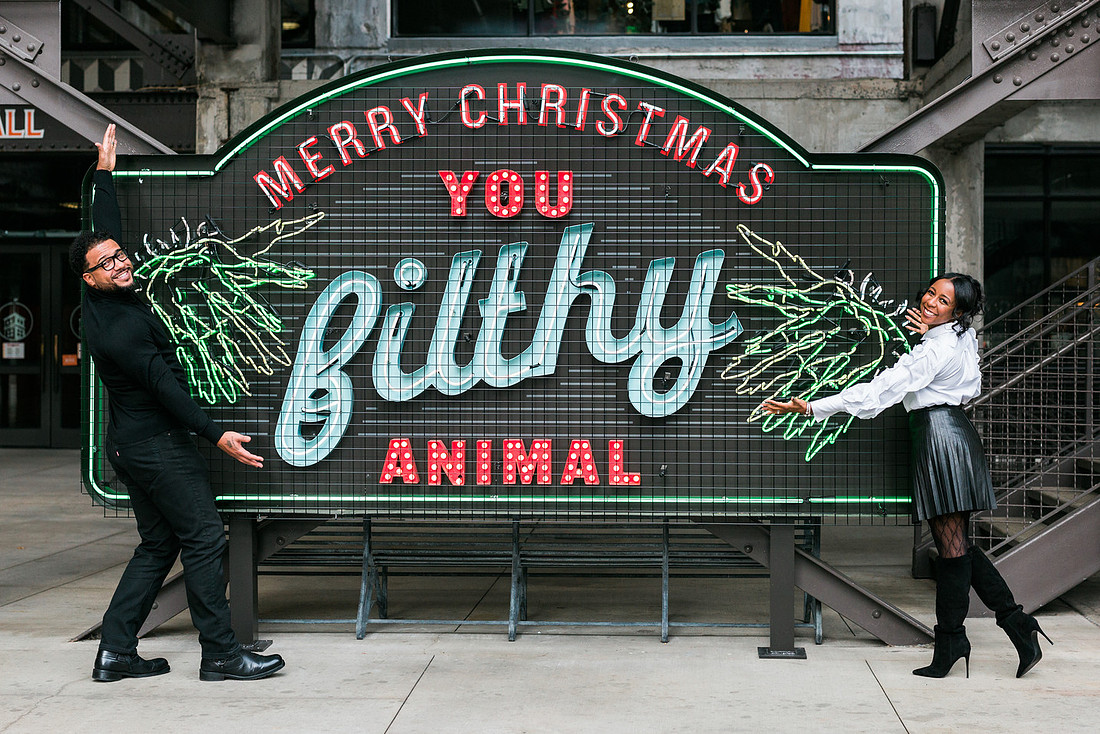 Joyful family moment captured outdoors at Ponce City Market during the holidays.